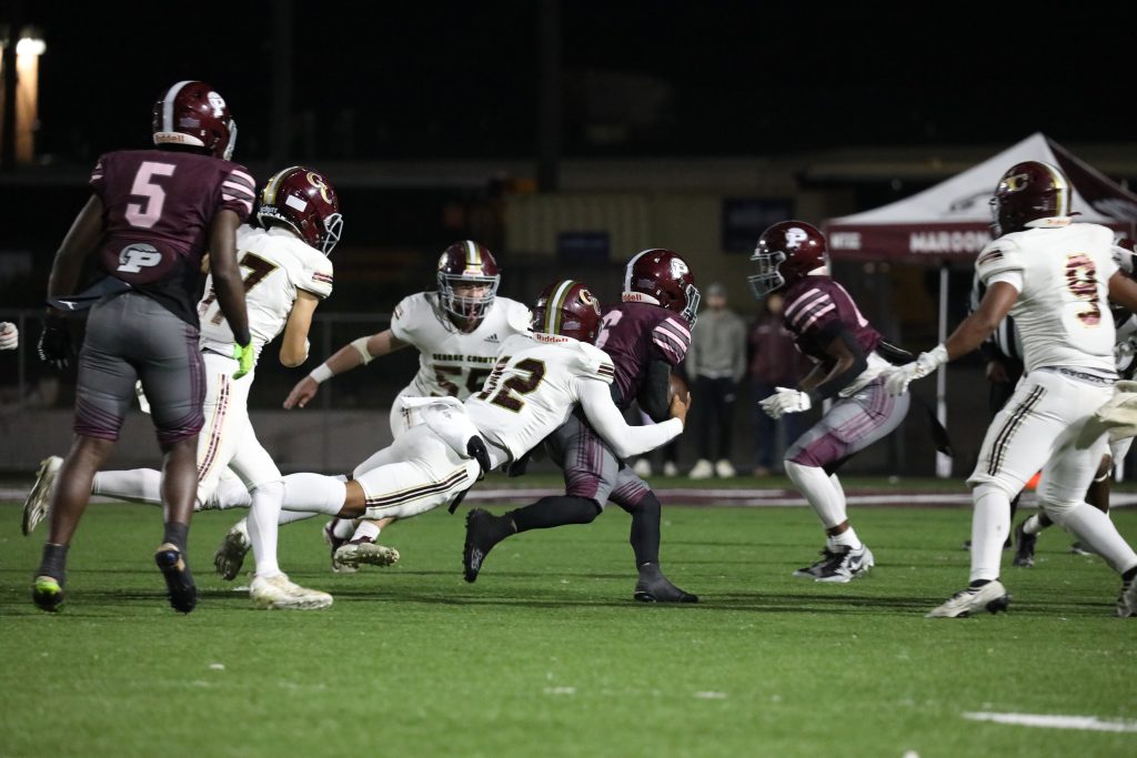 George County DB Randy Love secures a tackle for the Rebels.