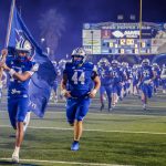 The Greyhounds storm the field.