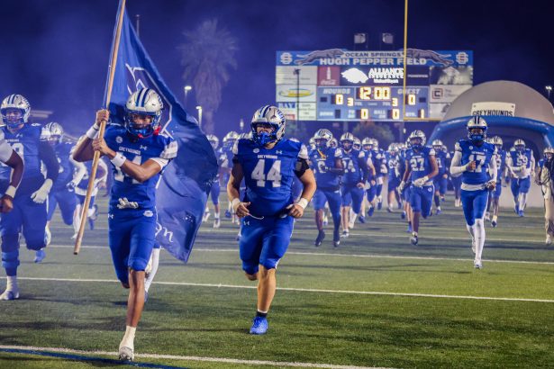 The Greyhounds storm the field.